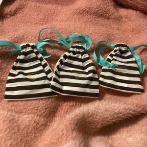 Three (3) Fossil dust bags